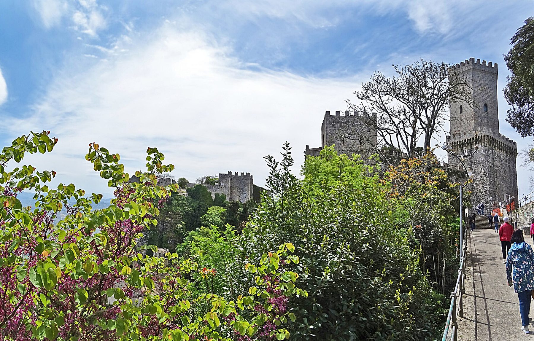 Norman castle tower above the gardens and trees of Erice, near the Quartiere Spagnolo.